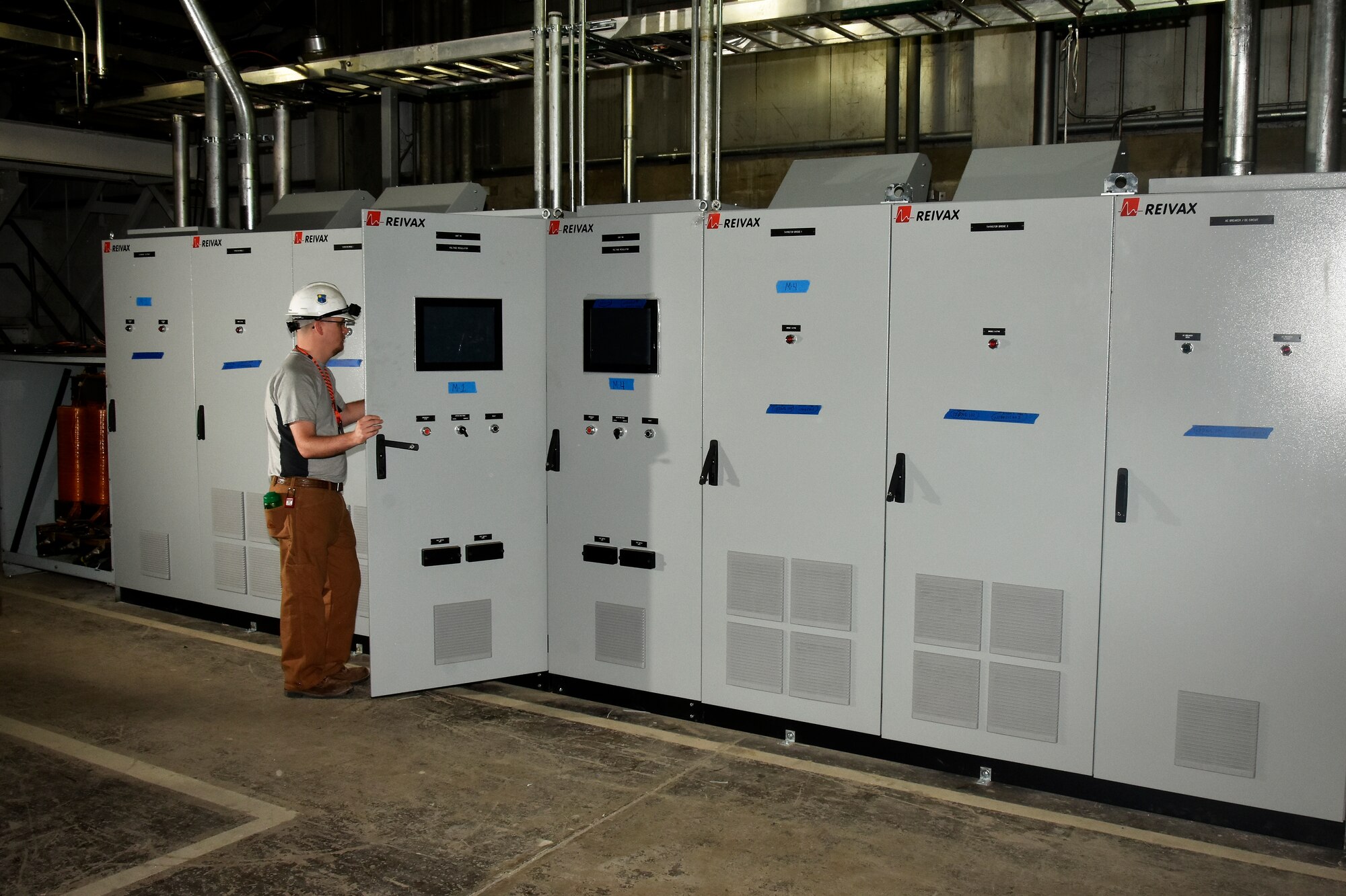 NAS Electrical Engineer Drew Owens checking out new exciter installation for PWT upgrade.
