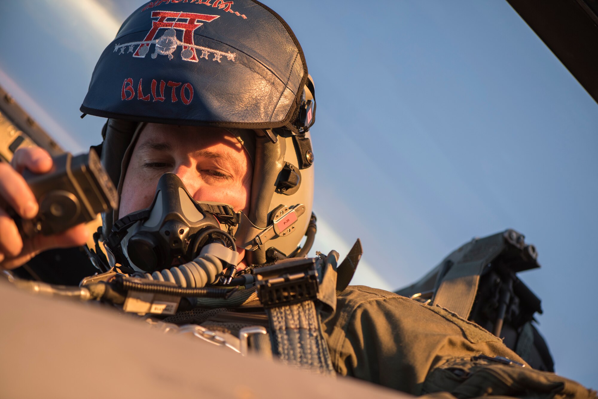 U.S. Air Force Maj. Charles Dodd, the 13th Fighter Squadron chief of wing weapons and a pilot, inspects his equipment prior to flight at Eielson Air Force Base, Alaska, Oct. 6, 2018. Exercise Red Flag-Alaska 19-1, held Oct. 4 to 19, allows U.S. forces to exchange knowledge and information with counterparts and allies from other countries. (U.S. Air Force photo by Airman 1st Class Collette Brooks)