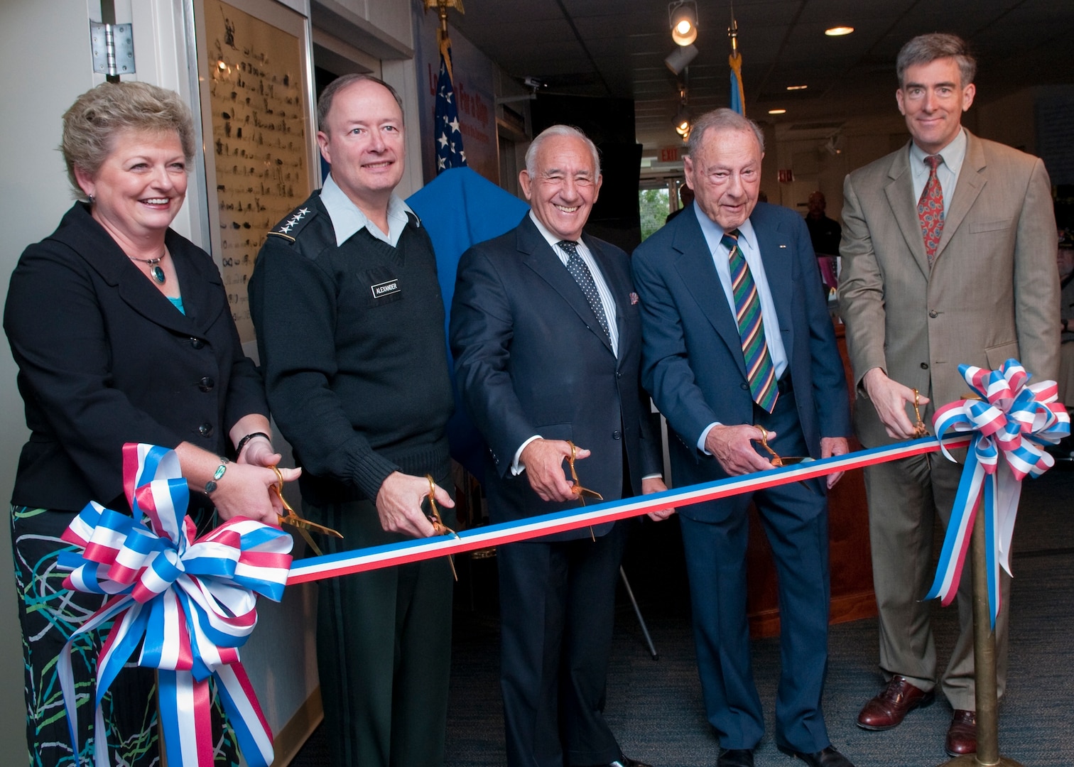 Photo of the Ribbon Cutting Ceremony (from left to right Judith Emmel, Associate Director for Strategic Communications, General Keith B. Alexander, USA, Commander, U.S. Cyber Command/Director, NSA/Chief, CSS, Dr. David Kahn, and Mr. John C. Inglis, Deputy Director, NSA)