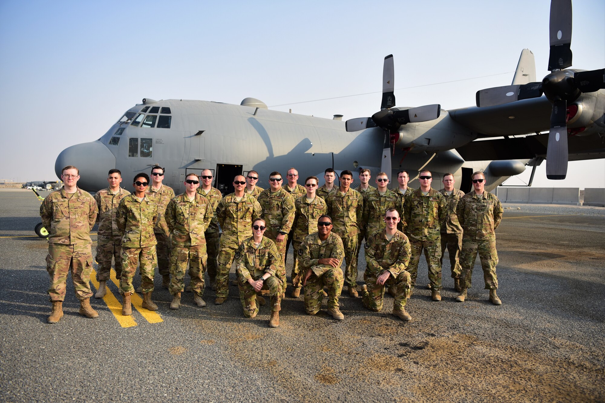 Members of the 43rd Expeditionary Electronic Combat Squadron and the 386th Expeditionary Aircraft Maintenance Squadron pose for a photo Sept. 21, 2018, at an undisclosed location in Southwest Asia. The 43rd EECS uses EC-130H aircraft to deny the communications capability enemy ground forces need to coordinate an attack, creating chaos and confusion. (U.S. Air Force photo by Staff Sgt. Christopher Stoltz)