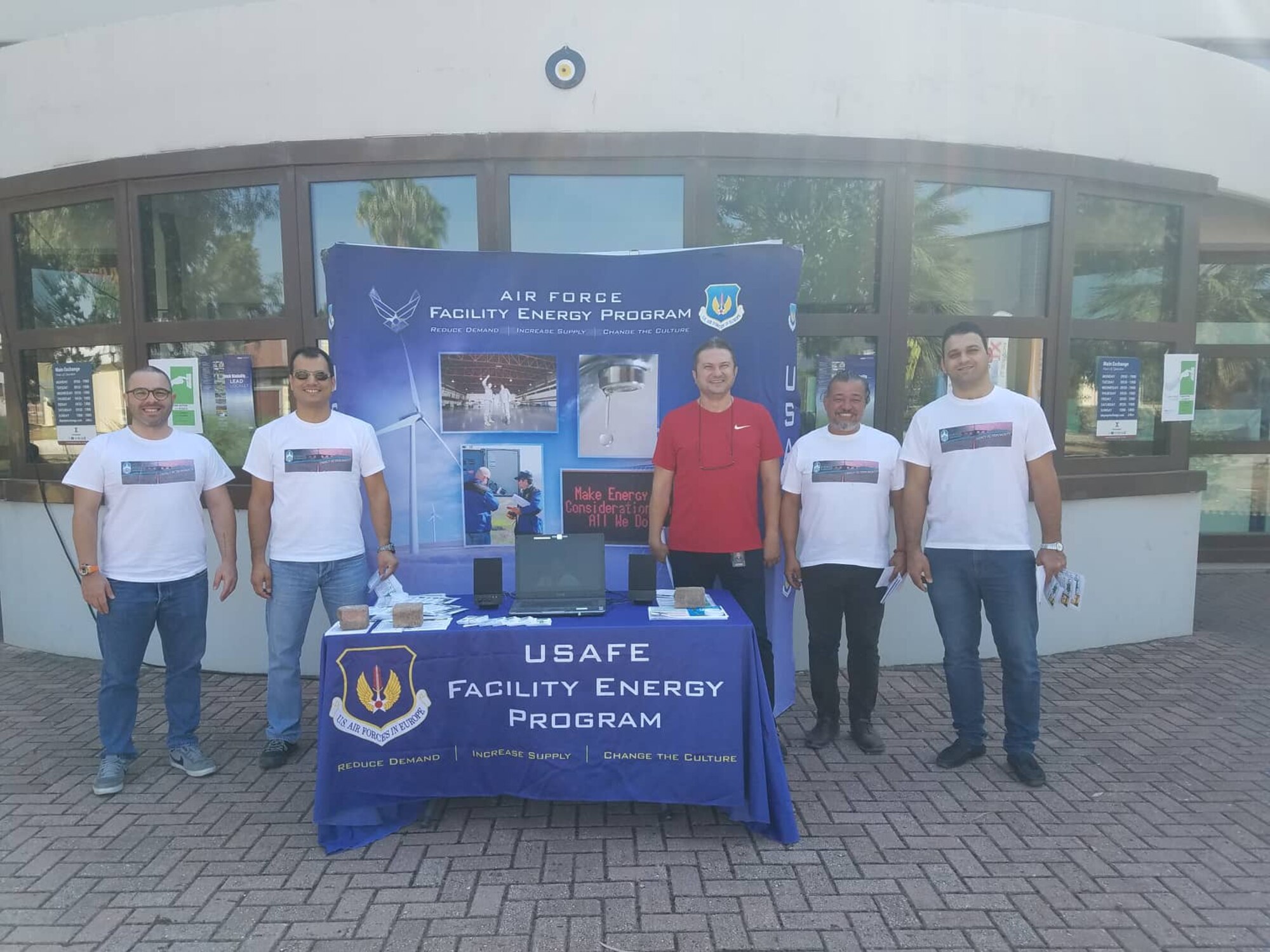 Members of the 39th Civil Engineer Squadron stand next to their table for Energy Action Month at Incirlik Air Base, Turkey, Oct. 5th, 2018.
