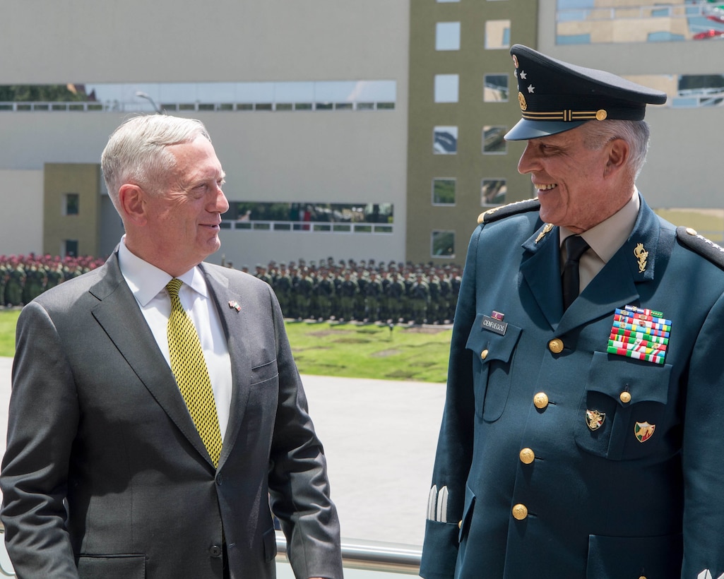 Defense Secretary Jim Mattis speaks with Mexican Army Gen. Salvador Cienfuegos Zepeda, the secretary of national defense, during an armed forces parade in Mexico City, Sept. 15, 2017. DOD photo by Air Force Staff Sgt. Jette Carr