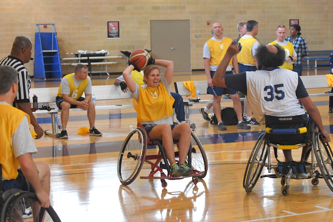 Col. Regina Sabric, 419th Fighter Wing commander, participates in the Wheelin' Wildcats wheelchair basketball game