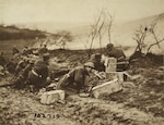 National Guard Soldiers of the 165th Infantry (formerly the 69th Regiment, New York National Guard) prepare to move forward with weapons at the ready during an attack at Landres-et-St. Georges in October 1918. The 165th Infantry fought as part of the 42nd “Rainbow” Division during St. Mihiel in September and Meuse-Argonne in October, part of the American Expeditionary Force 100 days offensive that brought an end to World War I.