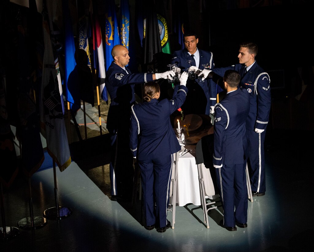 Members of the Eglin Honor Guard perform missing man table honors during the POW/MIA ceremony Sept. 21, 2018, at the Air Force Armament Museum located near Eglin Air Force Base, Fla. The ceremony was held in remembrance of America’s prisoners of war, those still missing in action and their families. (U.S. Air Force photo by Ilka Cole)