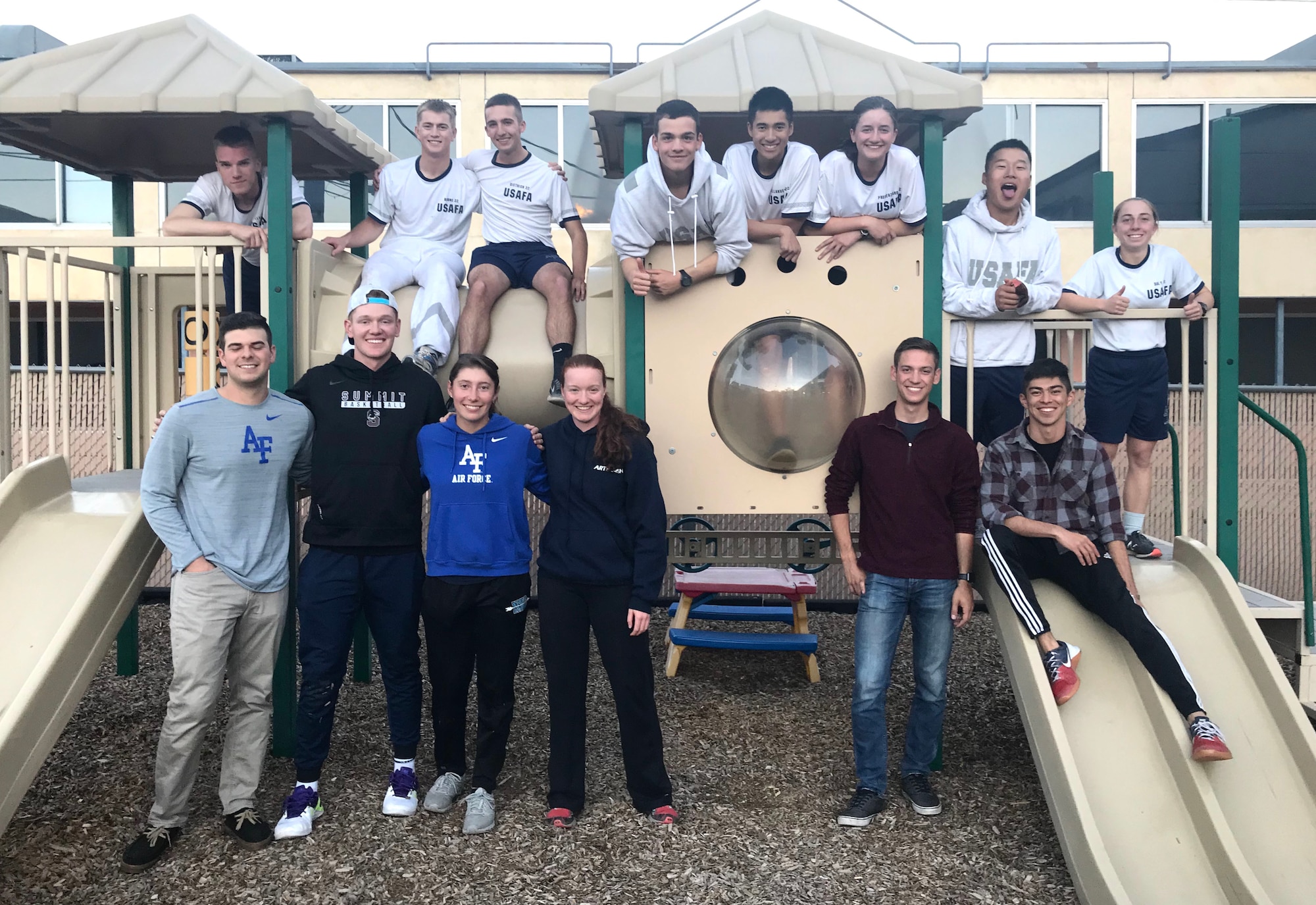 Air Force Academy cadets from Cadet Squadron 35 pose for a group photograph at the Children Enrichment Center in Colorado Springs, Colorado, Oct. 4, 2018. The CEC supports Partners in Housing, an organization that provides transitional housing to homeless families, with free daycare for parents during on-site life skills classes. (U.S. Air Force photo by Jennifer Spradlin)