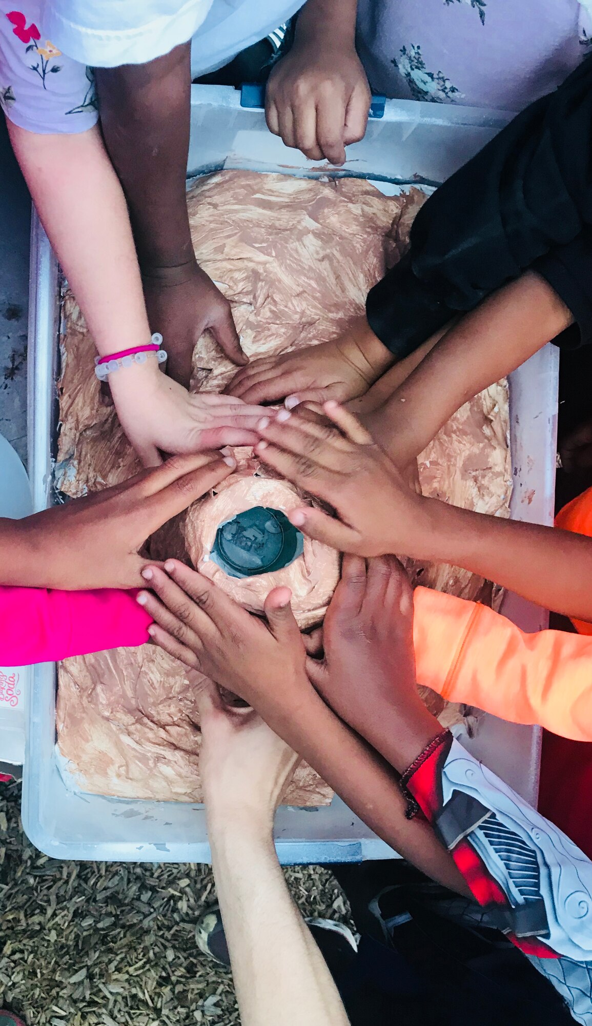 Children at the Children Enrichment Center in Colorado Springs, Colorado, pose with their paper mache volcano Oct. 4, 2018. Air Force Academy Cadets from Cadet Squadron 35 have volunteered at the CEC since March. The CEC supports Partners in Housing, an organization that provides transitional housing to homeless families, with free daycare for parents during on-site life skills classes. (U.S. Air Force photo by Jennifer Spradlin)