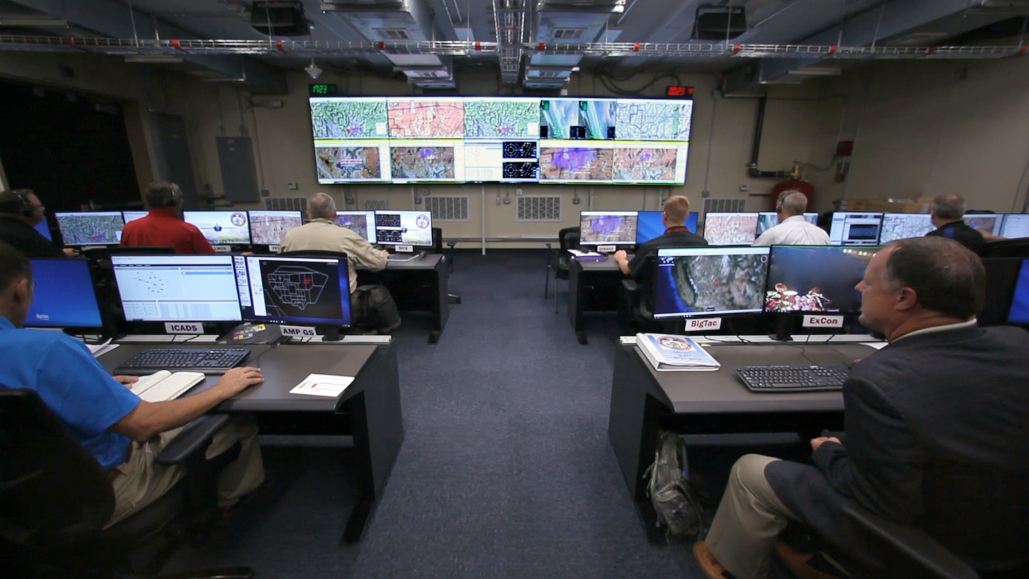 Part of the Secure Live Virtual Constructive Advanced Training Environment (SLATE) team sit in the operation center at Nellis Air Force Base, Nevada, during the Phase III capstone demonstration in September.(U.S. Air Force photo/William Graver)