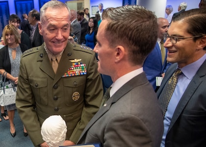 Marine Corps Gen. Joe Dunford, chairman of the Joint Chiefs of Staff, speaks to James Ferguson, founder of the Warrior Reunion Foundation of Cockeysville, Maryland, during the 2018 Newman’s Own Awards at the Hall of Heroes in the Pentagon, Oct. 5, 2018. The annual competition seeks to reward ingenuity for programs that benefit service men, women, and their families. DoD photo by Navy Petty Officer 1st Class Dominique A. Pineiro