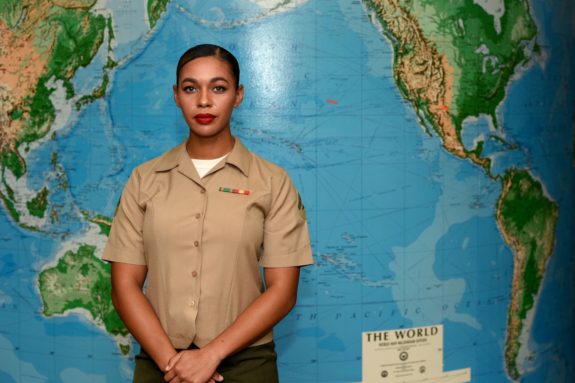 U.S. Marine Corps Lance Cpl. Destiny Creecy, Marine Corps Detachment at Goodfellow student, stands in front of a map at Brandenburg Hall on Goodfellow Air Force Base, Texas, Oct. 5, 2018. Creecy is the Goodfellow Student of the Month spotlight for September 2018, a series highlighting Goodfellow students. (U.S. Air Force photo by 2nd Lt. Matthew Stott/Released)