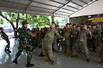 Soldiers with the Indiana Army National Guard's 76th Infantry Brigade Combat Team and their Indonesian counterparts from the Tentara Nasional Indonesia army kick off Garuda Shield 18 by conducting a "Yel-Yel," a cry-and-response war dance, July 29, 2018, in Indonesia. Garuda Shield 18 is the third exercise in U.S. Army Pacific's second iteration of Pacific Pathways, a series of multinational engagements with ally and partner militaries in the Indo-Pacific region.