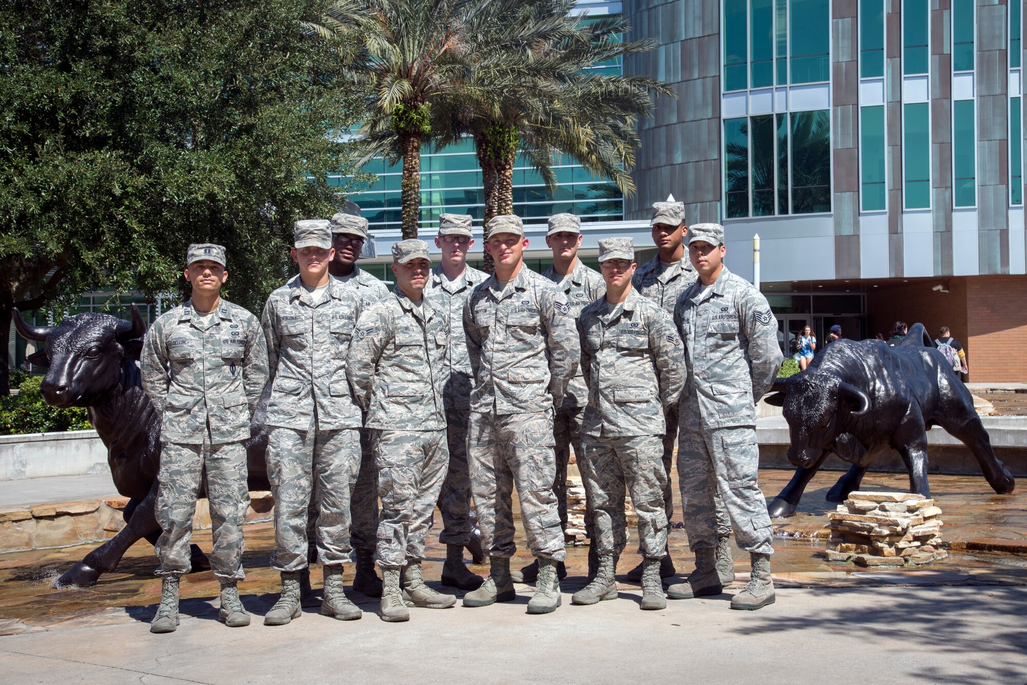 Ten U.S. Air Force Airmen assigned to the 6th Operational Support Squadron at MacDill Air Force Base, Fla., pause for a photo at the University of South Florida, Tampa campus, Sept. 20, 2018.