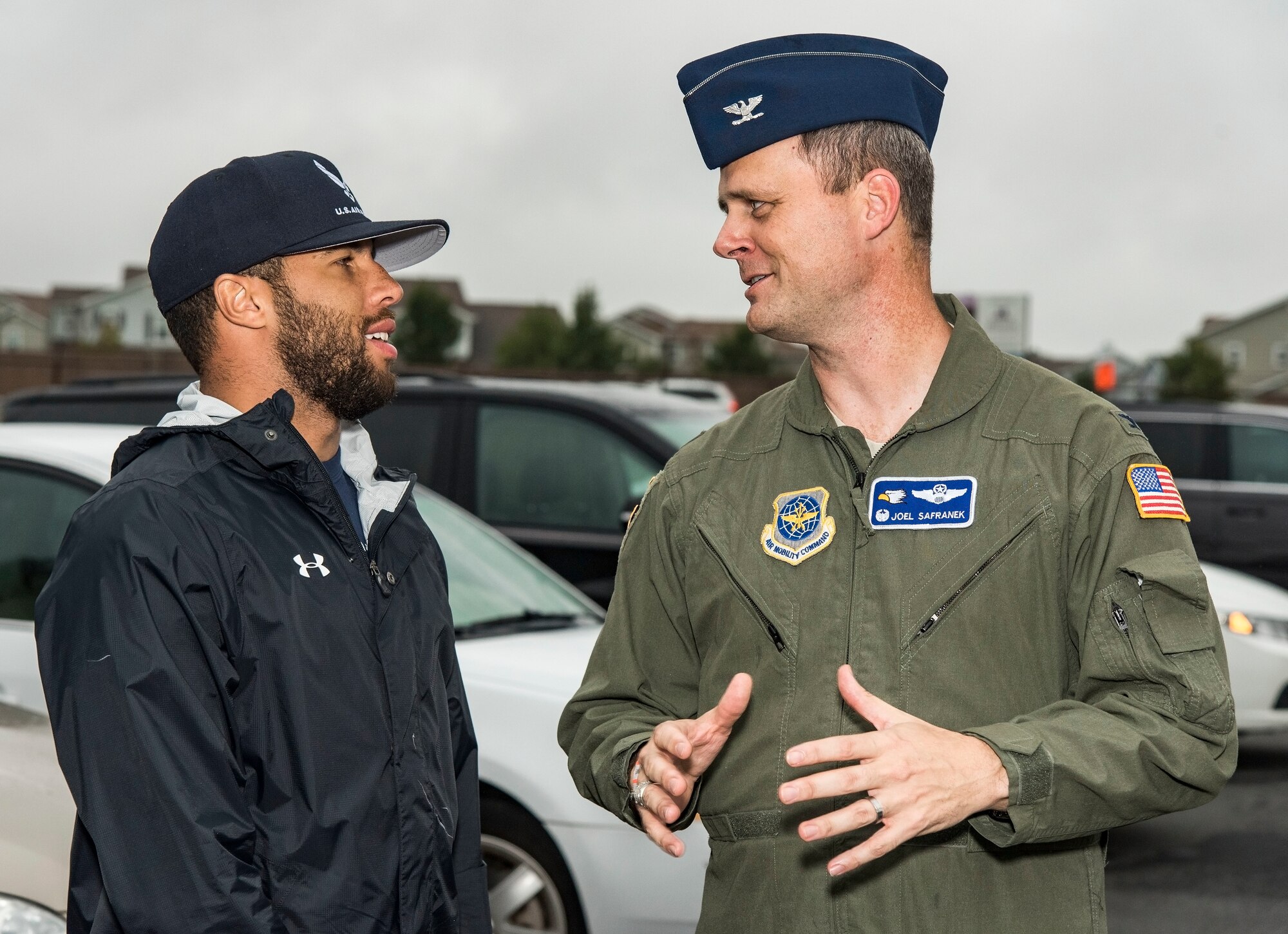 Col. Joel Safranek, 436th Airlift Wing commander, speaks with Bubba Wallace, driver of the No. 43 World Wide Technology Chevrolet in the Monster Energy NASCAR Cup Series, prior to arriving at the NASCAR Social Oct. 5, 2018, at The Landings on Dover Air Force Base, Del. Wallace provided autographed information cards to attendees. (U.S. Air Force photo by Roland Balik)