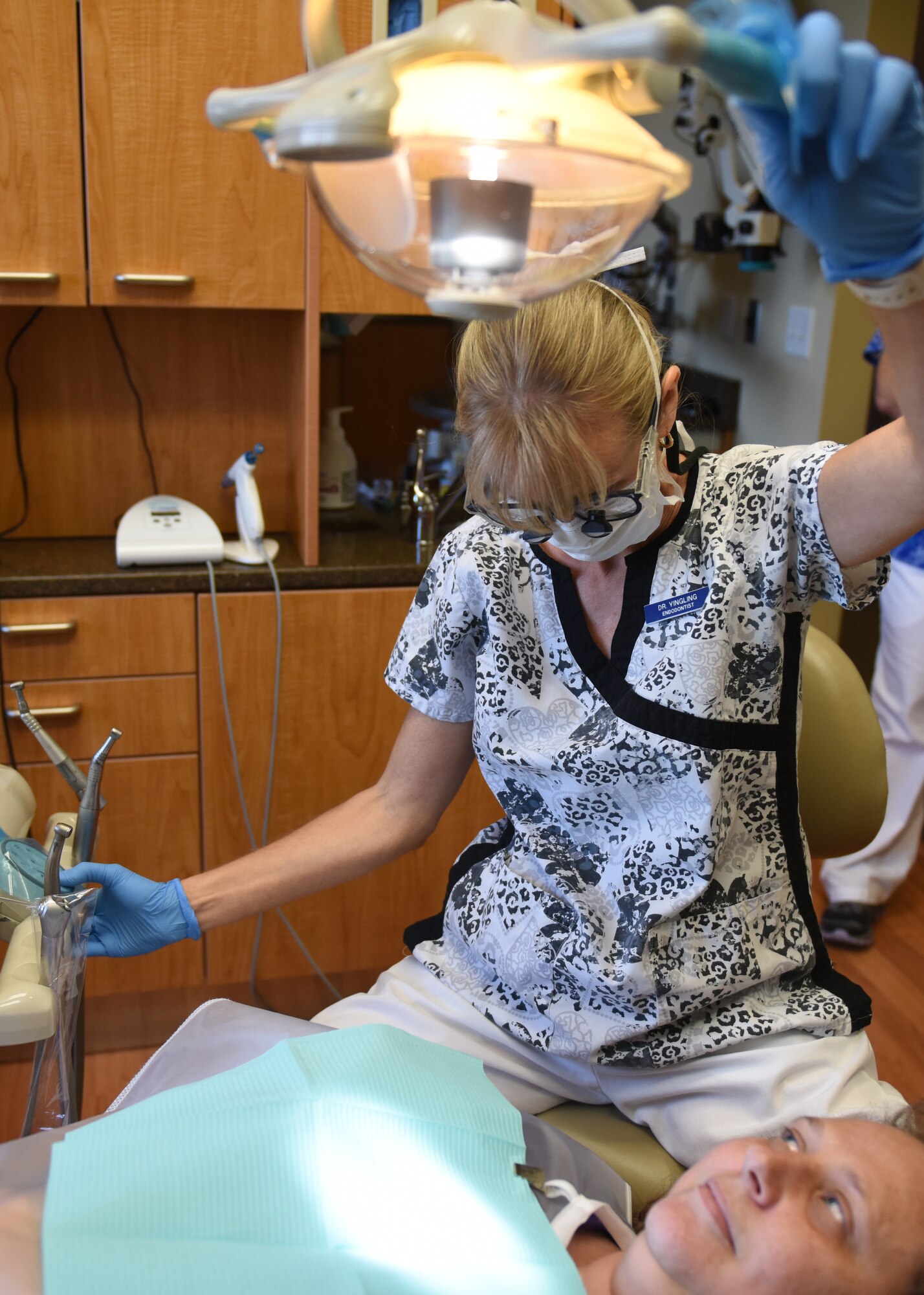 Dr. Nicole Yingling, endodontist and owner of Mason-Dixon Endodontics, Chambersburg, Pennsylvania, prepares to perform a checkup of previous work done on a patient Oct. 1, 2018. Yingling began her career as a general dentist and later specialized in endodontics, which focuses on the treatment of root canals. Yingling served 11 years as an active duty dentist and after a 12-year break-in-service, enlisted into the 193rd Special Operations Medical Group, Middletown, Pennsylvania. (U.S. Air National Guard photo by Senior Airman Julia Sorber/Released)
