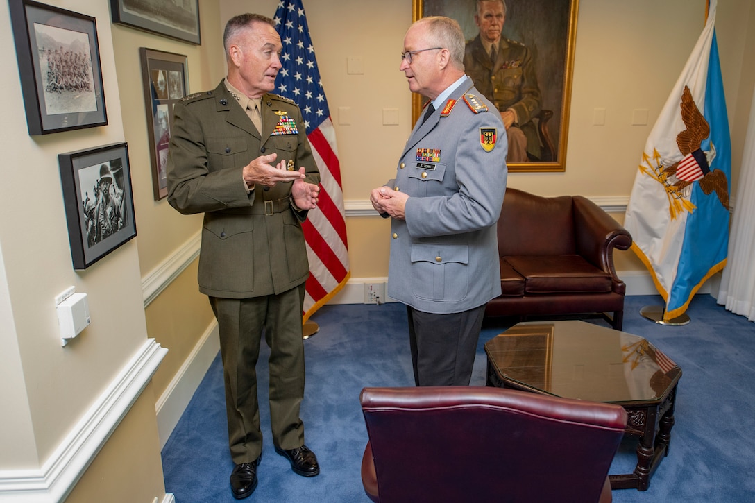 Marine Corps Gen. Joe Dunford, chairman of the Joint Chiefs of Staff, gives German Inspector Gen. Eberhard Zorn, chief of staff of the Federal Armed Forces, a tour of his office at the Pentagon.