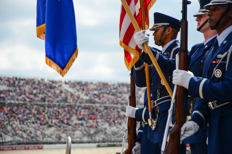 The Dover Air Force Base Honor Guard presents colors during the opening ceremony for the “Gander Outdoors 400” Monster Energy NASCAR Cup Series race Oct. 7, 2018, at the Dover International Speedway in Dover, Del. Dover NASCAR races are held biannually and encourage community and Team Dover involvement. (U.S. Air Force photo by Airman First Class Dedan D. Dials)