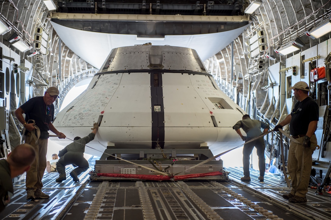 The NASA Orion test capsule is loaded into a C-17 Globemaster III on loan from Joint Base Lewis-McChord, Washington, Sept. 10, 2018. The mock capsule was later pulled out the back of the cargo plane Sept. 12 for its final parachute system test over the U.S. Army’s Yuma Proving Ground in Arizona. (U.S. Air Force photo by Kyle Larson)