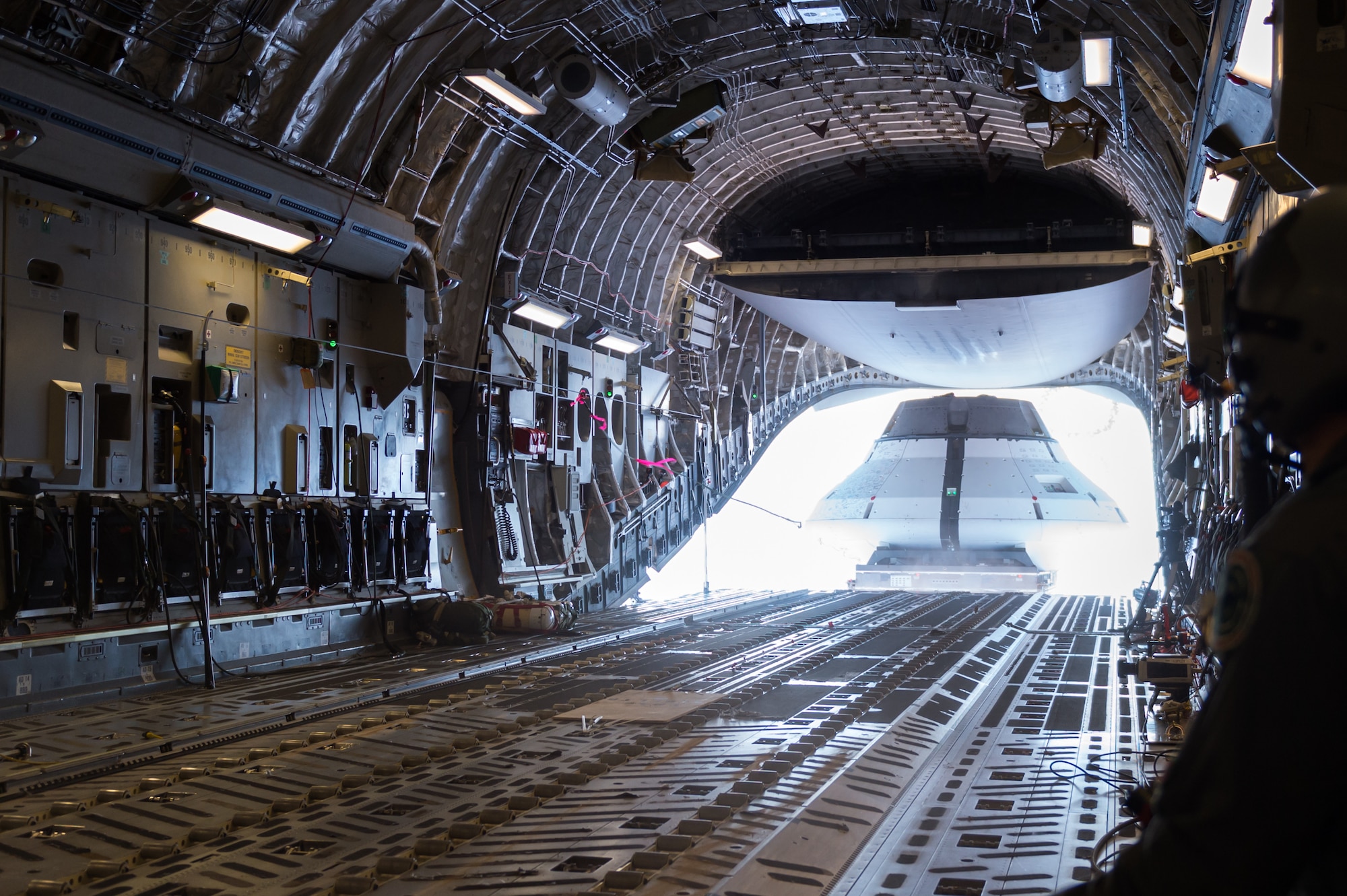 A mockup of an Orion spacecraft is released from a C-17 Globemaster III Sept. 12, 2018, over the U.S. Army Yuma Proving Ground in Arizona. Airmen and testers from the 418th Flight Test Squadron joined Army, NASA and contractor personnel to participate in the final test of the Orion’s parachute landing system. (U.S. Air Force photo by Kyle Larson)