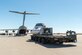 The NASA Orion test capsule sits on a K-loader about to be lifted into the C-17 Globemaster III on loan from Joint Base Lewis-McChord, Washington, Sept. 10, 2018. The mock capsule was later pulled out the back of the cargo plane Sept. 12 for its final parachute system test over the U.S. Army’s Yuma Proving Ground in Arizona. (U.S. Air Force photo by Kyle Larson)