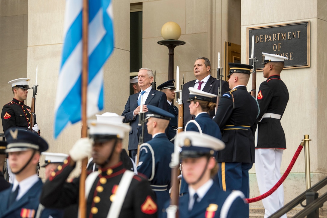 Defense Secretary James N. Mattis and his Greek counterpart stand on the Pentagon steps, flanked by service members.