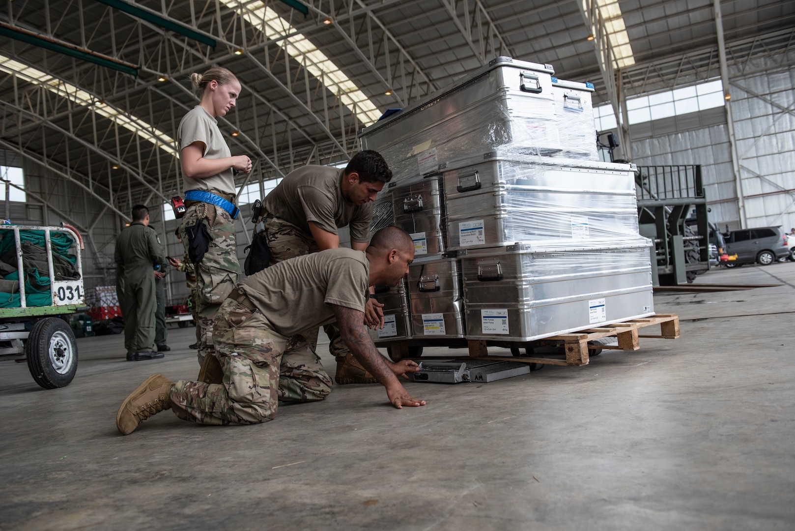 U.S. Air Force aerial porters assigned to the 36th Contingency Response Group Andersen Air Force Base, Guam, prepare and inspect cargo at the airport in Balikpapan, Indonesia Oct. 5, 2018. The airport is the staging ground for all humanitarian goods before being transported to Palu, Indonesia where they are received and distributed to those affected by the 7.5 magnitude earthquake and tsunami. (U.S. Air Force photo by Master Sgt. JT May III)