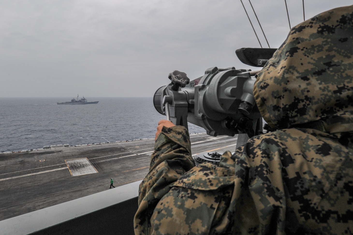 PHILIPPINE SEA (October 10, 2018) Seaman Esmeralda Anaya, from Waterbury, Connecticut, stands lookout watch aboard the Navy's forward-deployed aircraft carrier USS Ronald Reagan (CVN 76) during a cooperative deployment with the Japan Air Self-Defense Force. Ronald Reagan, the flagship of Carrier Strike Group 5, provides a combat-ready force that protects and defends the collective maritime interests of its allies and partners in the Indo-Pacific region.