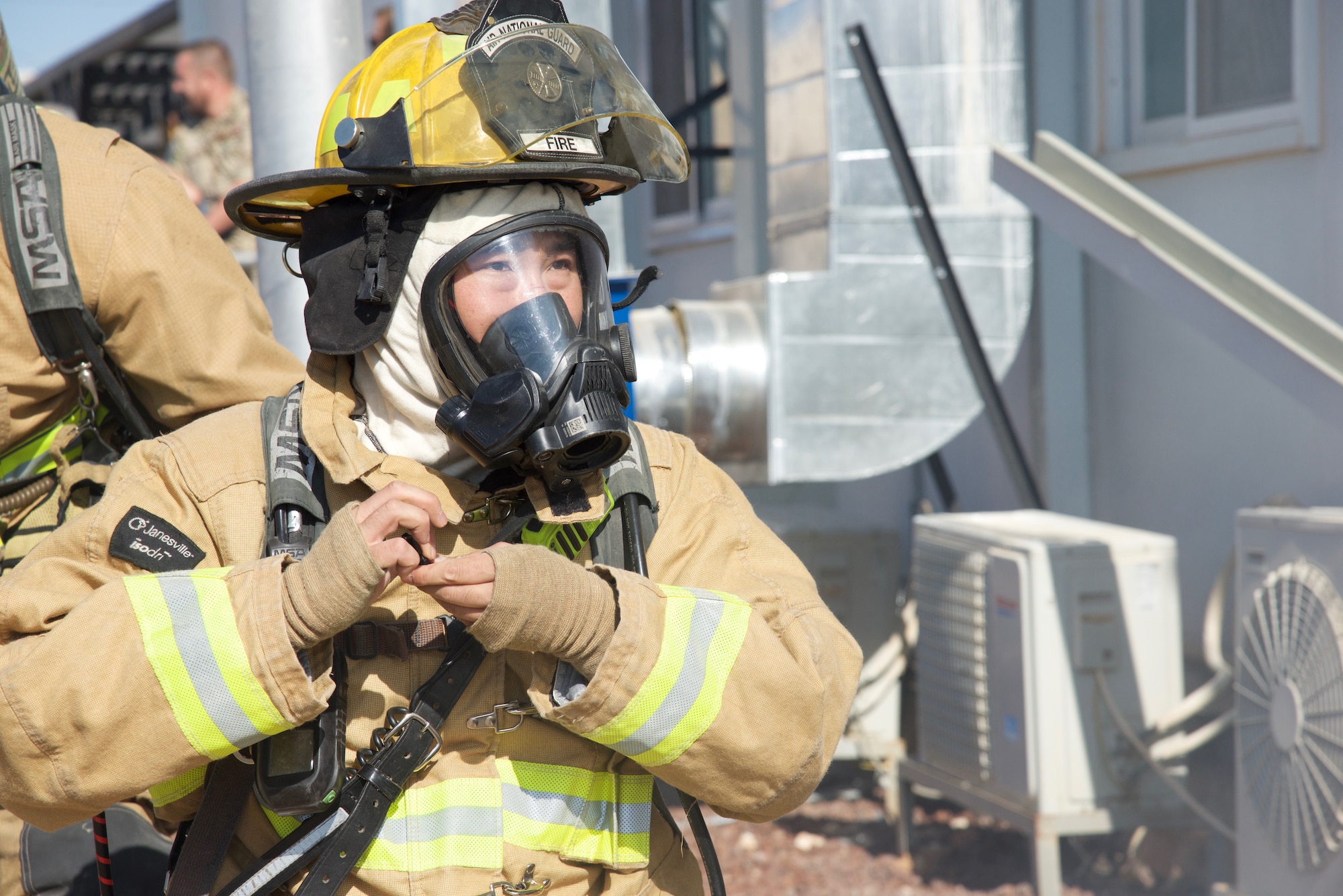 Staff Sgt. Vincent Kinard, 332nd Expeditionary Civil Engineer Squadron Fire Department firefighter, prepares a firehose for a simulated fire during an exercise, Sept. 22, 2018, at an undisclosed location in Southwest Asia.