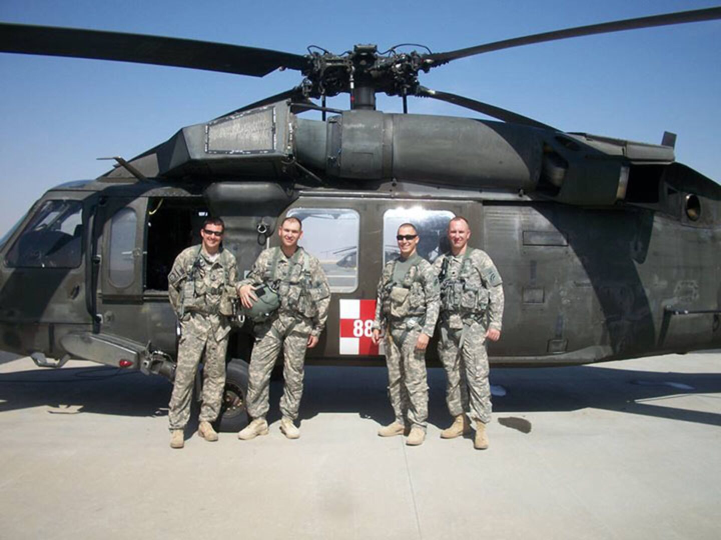 New York Army National Guard Maj. Stephen Carson, second from left, is seen with his aeromedical flight crew at Udairi Airfield after a mission during his deployment to Kuwait in 2013-14. Carson, then a captain, served as a Physician’s Assistant in support of the New York Army National Guard’s 642nd Support Battalion, part of the 42nd Combat Aviation Brigade.