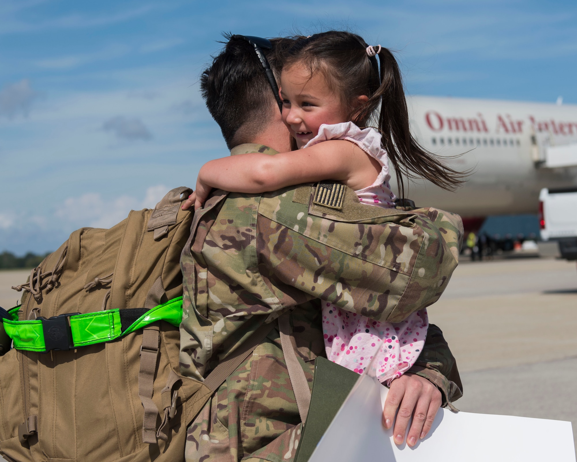 U.S. Air Force Senior Airman Matthew Adams, 1st Maintenance Squadron low observable technician, hugs his daughter, Lilly, 4, at Joint Base Langley-Eustis, Virginia, Oct. 9, 2018.