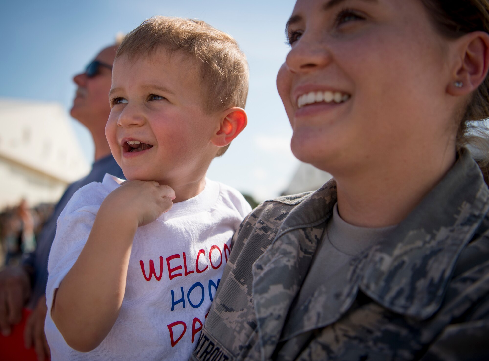 Right, U.S. Air Force Staff Sgt. Britney Armentrout, 1st Operations Support Squadron airfield management training NCO in charge, and her son, Greyson Ramsey, wait to greet their family member as they return from deployment at Joint Base Langley-Eustis, Virginia, Oct. 1, 2018