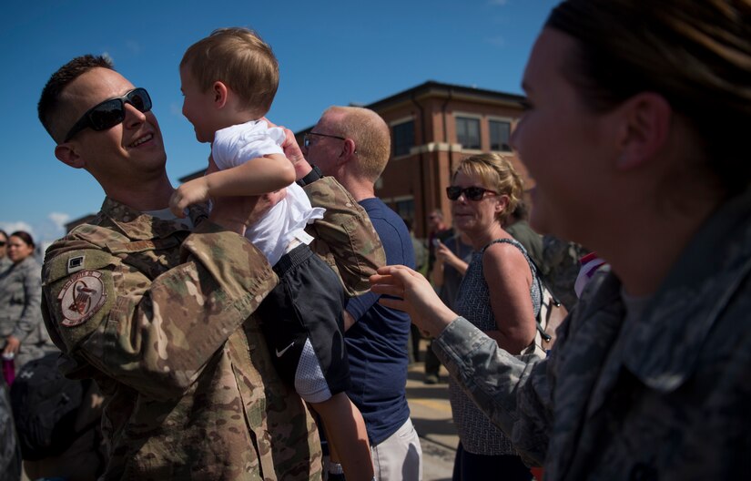 U.S. Air Force Staff Sgt. Matthew Ramsey, 1st Operations Support Squadron aircrew flight equipment technician, is greeted by his son Greyson as he returns from deployment at Joint Base Langley-Eustis, Virginia, Oct. 9, 2018.