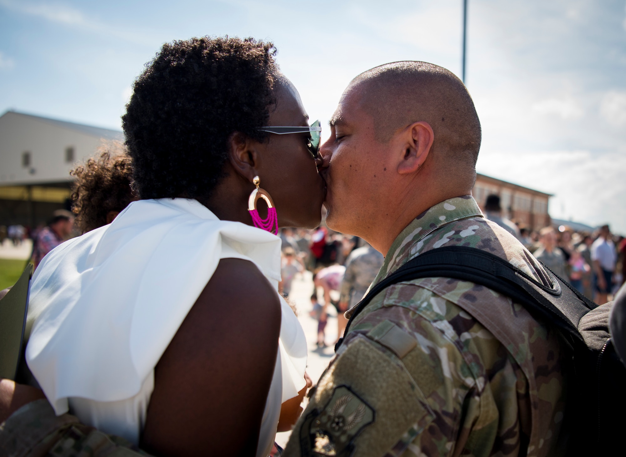Right, U.S. Air Force Master Sgt. Victor Chavez, 1st Maintenance Squadron fabrication flight chief, is greeted by his wife Denise Chavez as he returns from deployment at Joint Base Langley-Eustis, Virginia, Oct. 9, 2018