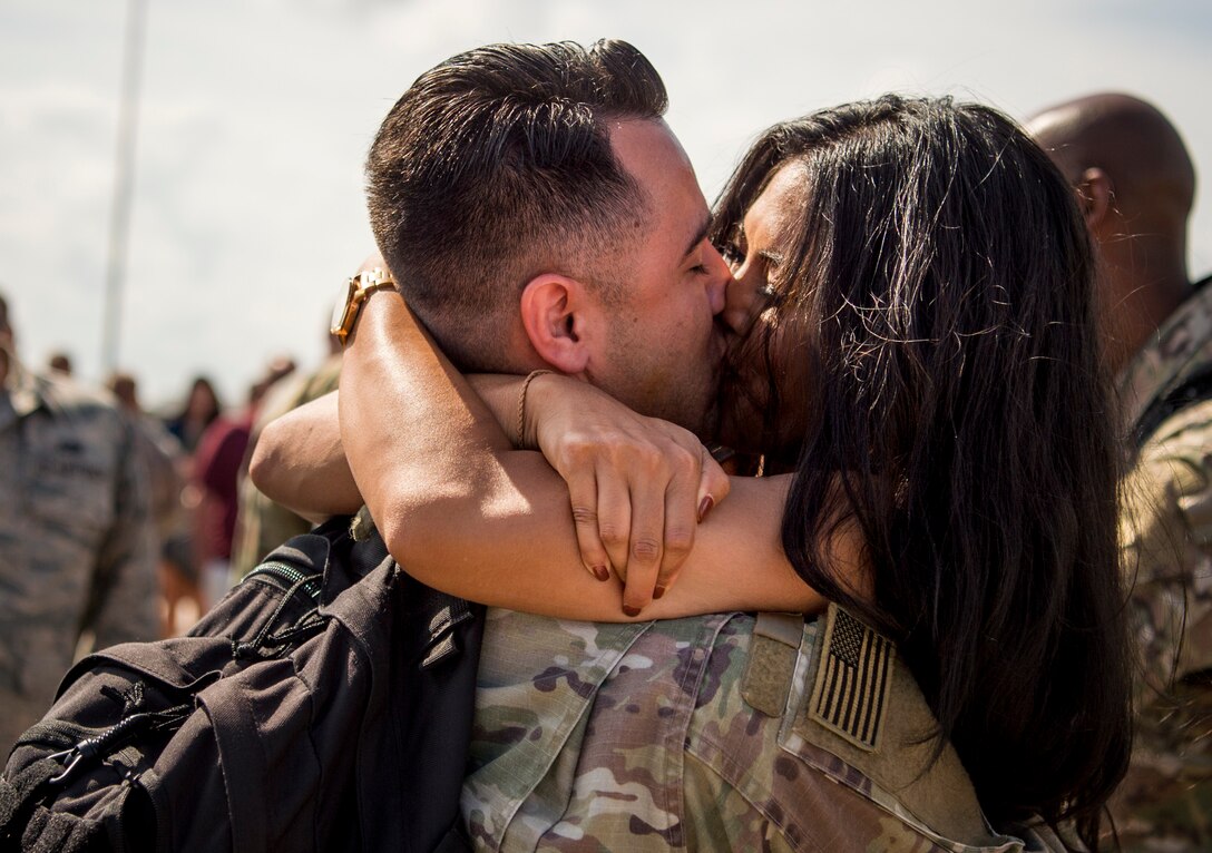 U.S. Air Force Airman 1st Class Cecil Chaney, 1st Maintenance Squadron nondestructive inspection technician, is greeted by Lena Tes as he returns from deployment at Joint Base Langley-Eustis, Virginia, Oct. 9, 2018.