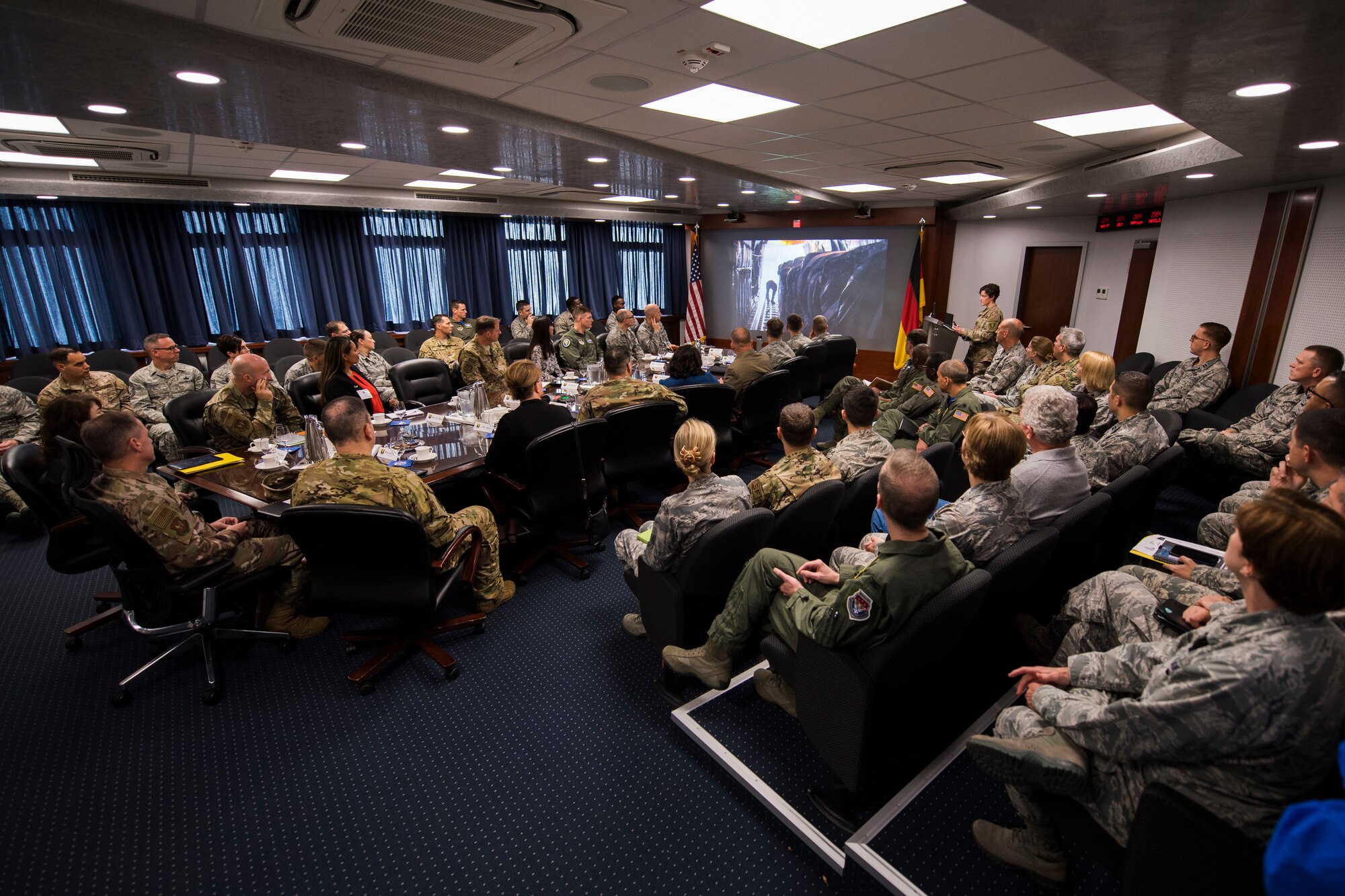 Leadership from across the 86th Airlift Wing attend a mission brief with Maj. Gen. John Wood, Third Air Force commander, and Command Chief Master Sgt. Anthony Cruz Munoz during an immersion tour of the 86th AW Oct. 5, 2018, at Ramstein Air Base, Germany. The tour began with a mission video showing Ramstein’s diverse mission set. (U.S. Air Force photo by Senior Airman Devin M. Rumbaugh)