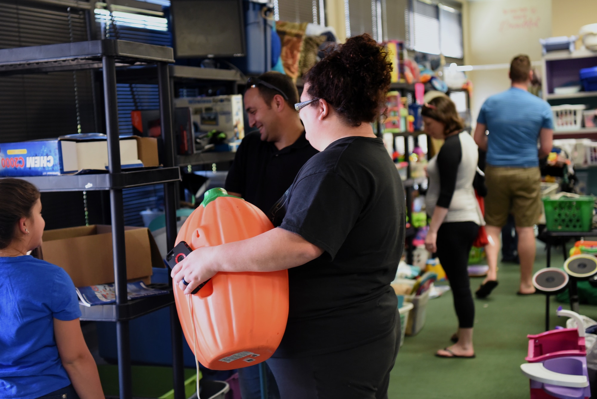 Jennifer Kaylor, 20th Force Support Squadron Attic coordinator, prepares to bag a customer’s items at Shaw Air Force Base, S.C., Oct. 4, 2018.