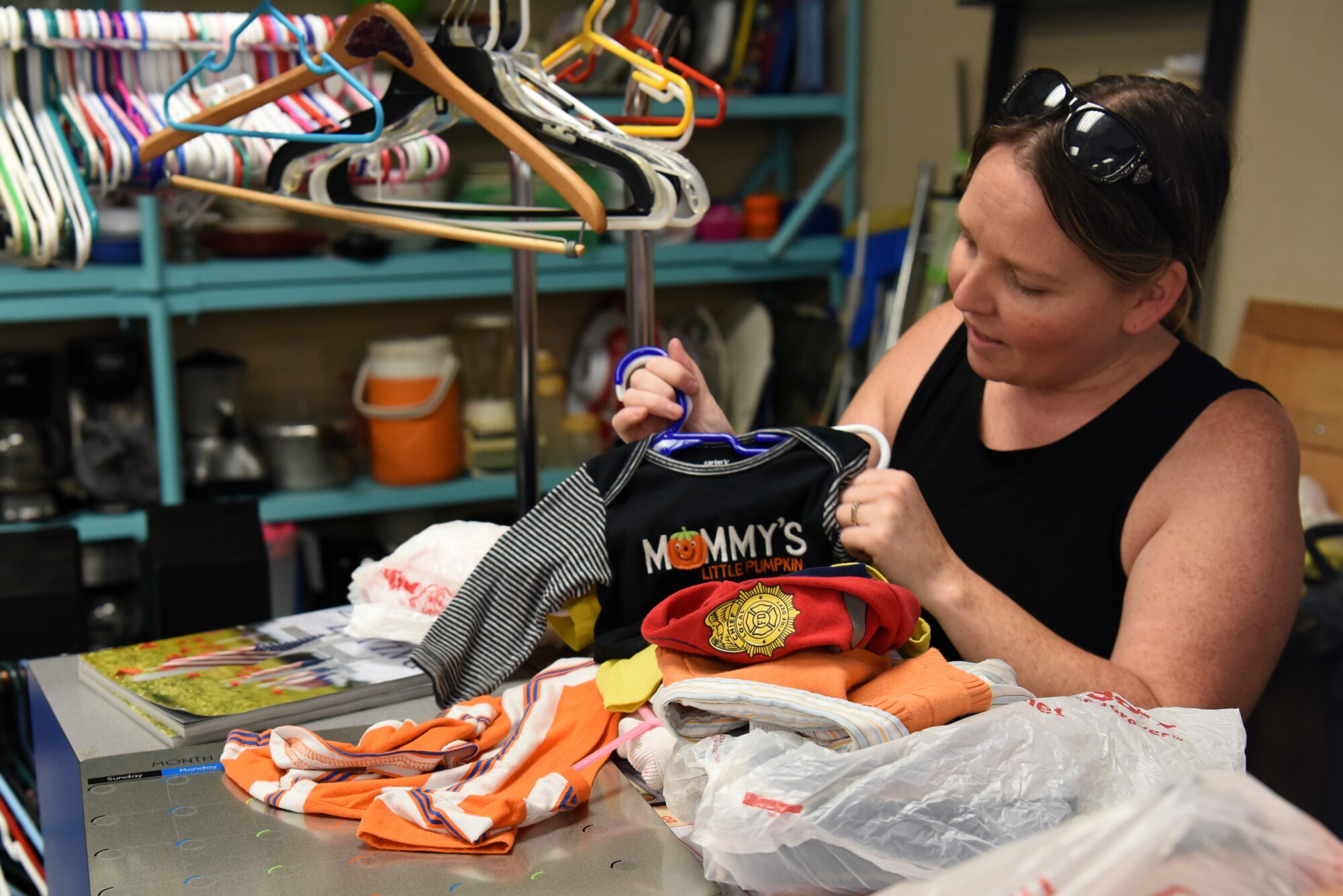 Jennifer Kaylor, 20th Force Support Squadron Attic coordinator, prepares to bag a customer’s items at Shaw Air Force Base, S.C., Oct. 4, 2018.