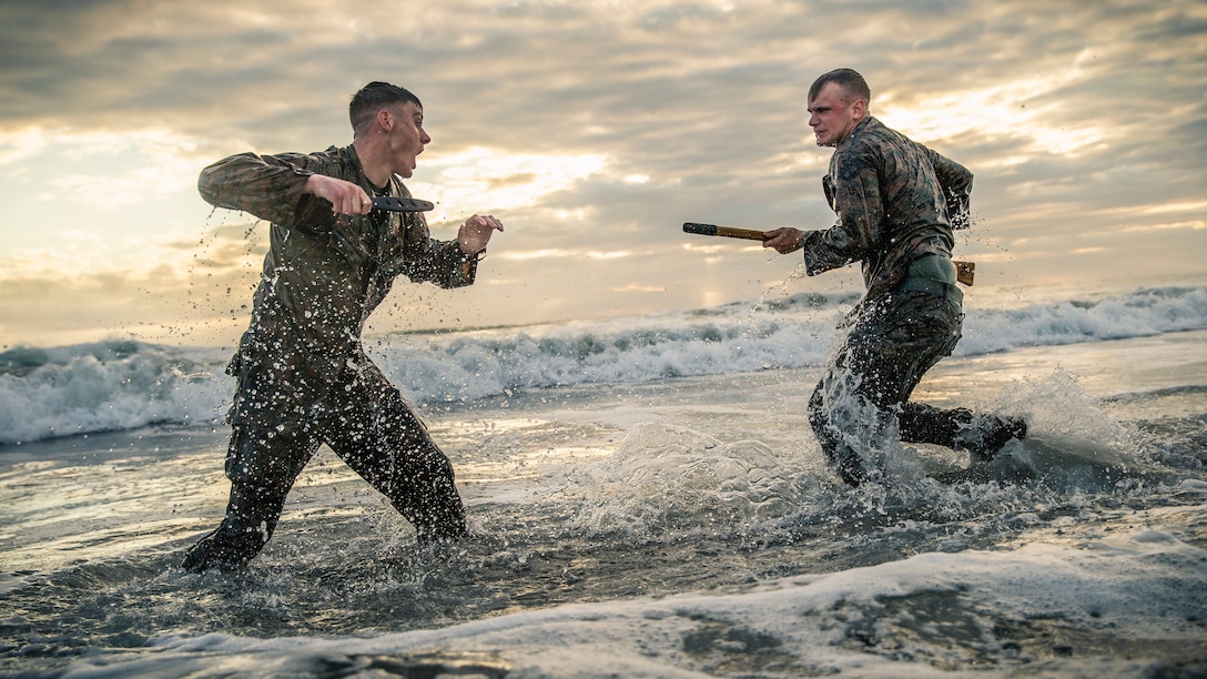 Cpl. Matthew Teutsch, on the left, and Cpl. Brett Norman, both combat videographers with the 11th Marine Expeditionary Unit, participate in hand-to-hand and close quarters combat during martial arts training at Camp Pendleton, Calif., Oct. 2, 2018. The Marines worked on offensive and defensive techniques utilizing different weapons systems focusing on the motto of the Martial Arts Program: “One Mind, Any Weapon.”
