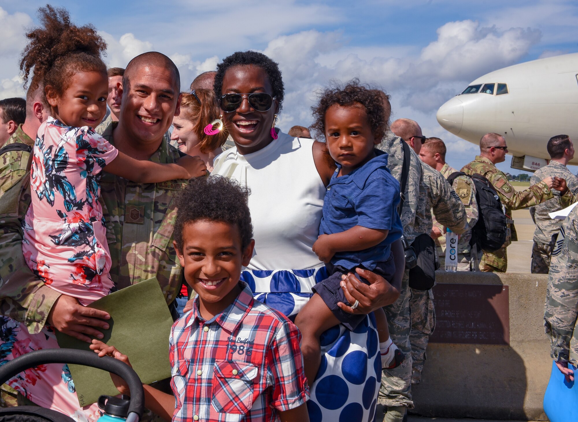 U.S. Air Force Master Sgt. Victor Chavez, 1st Maintenance Squadron, poses for a photo with his family after returning to  Joint Base Langley-Eustis, Virginia, Oct. 9, 2018. During a 6-month deployment, the U.S. Air Force Airmen and F-22 Raptors delivered air superiority during combat operations, supporting Operation Inherent Resolve and the fight against enemy forces in Iraq and Syria. (U.S. Air Force Photo by Staff Sgt. Carlin Leslie)