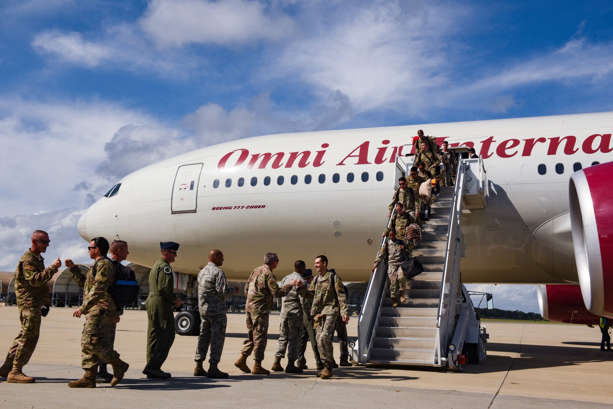 U.S. Air Force Airmen assigned to the 94th Fighter Squadron return to Joint Base Langley-Eustis, Virginia, Oct. 9, 2018.  During a 6-month deployment, the U.S. Air Force Airmen and F-22 Raptors delivered air superiority during combat operations, supporting Operation Inherent Resolve and the fight against enemy forces in Iraq and Syria. (U.S. Air Force Photo by Staff Sgt. Carlin Leslie)