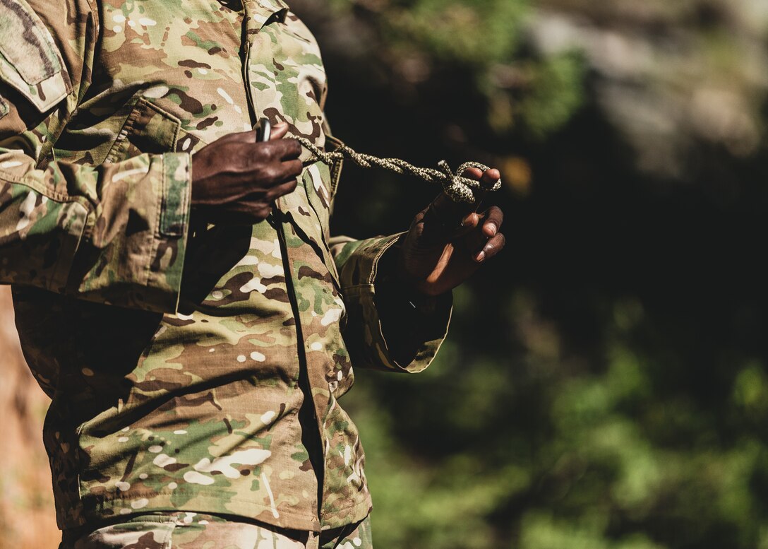 A U.S. Army Special Forces soldier with Operational Detachment Alpha practices tying knots for a training exercise involving a tyrolean traverse, aboard Marine Corps Mountain Warfare Training Center, Bridgeport, Calif., July 28, 2018. Any special operations force element that comes to MCMWTC has the opportunity to do their list of schools; ranging from Assault Climber, Mountain Medicine, Mountain Sniper and others, or they can program their own training through use of an internal mountaineering subject matter expert. (U.S. Marine Corps photo by Lance Cpl. Rachel K. Young)