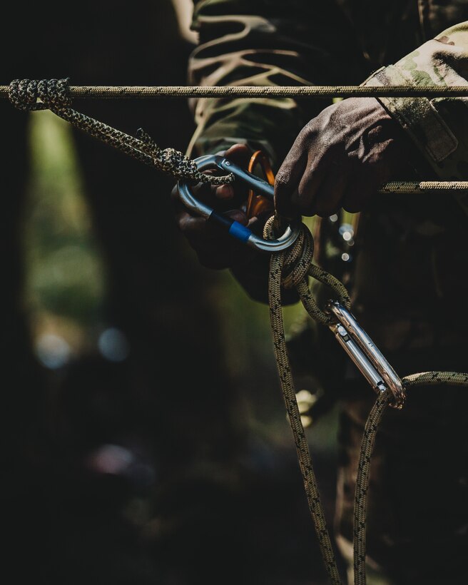 A U.S. Army Special Forces soldier with Operational Detachment Alpha conducts a course to prepare fellow unit members for a training exercise involving a tyrolean traverse over an 80-foot gorge at the Marine Corps Mountain Warfare Training Center, Bridgeport, Calif., July 23, 2018. Any special operations force element that comes to MCMWTC has the opportunity to do their list of schools; ranging from Assault Climber, Mountain Medicine, Mountain Sniper and others, or they can program their own training through use of an internal mountaineering subject matter expert. (U.S. Marine Corps photo by Lance Cpl. Rachel K. Young)