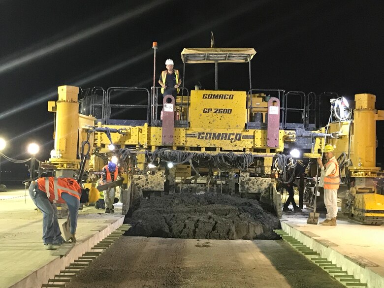 Contractors work at night to finish runway repairs at an undisclosed location in the Middle East.
