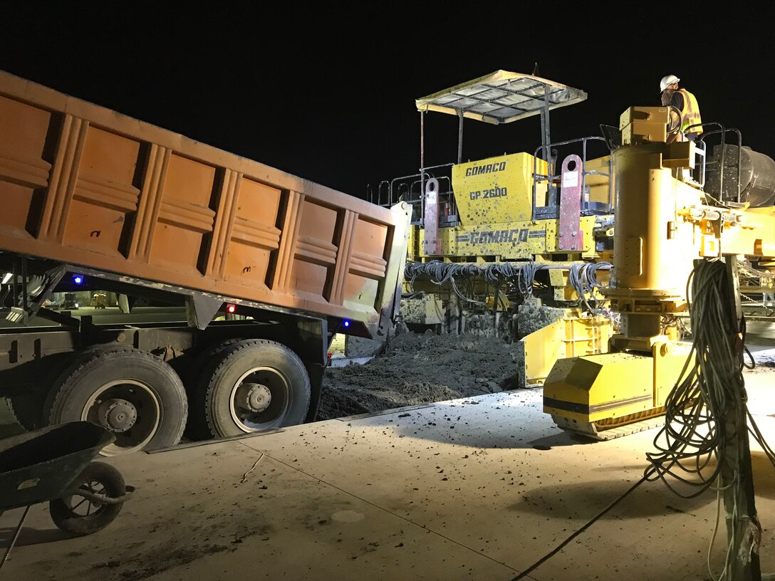 Contractors work at night to finish runway repairs at an undisclosed location in the Middle East.