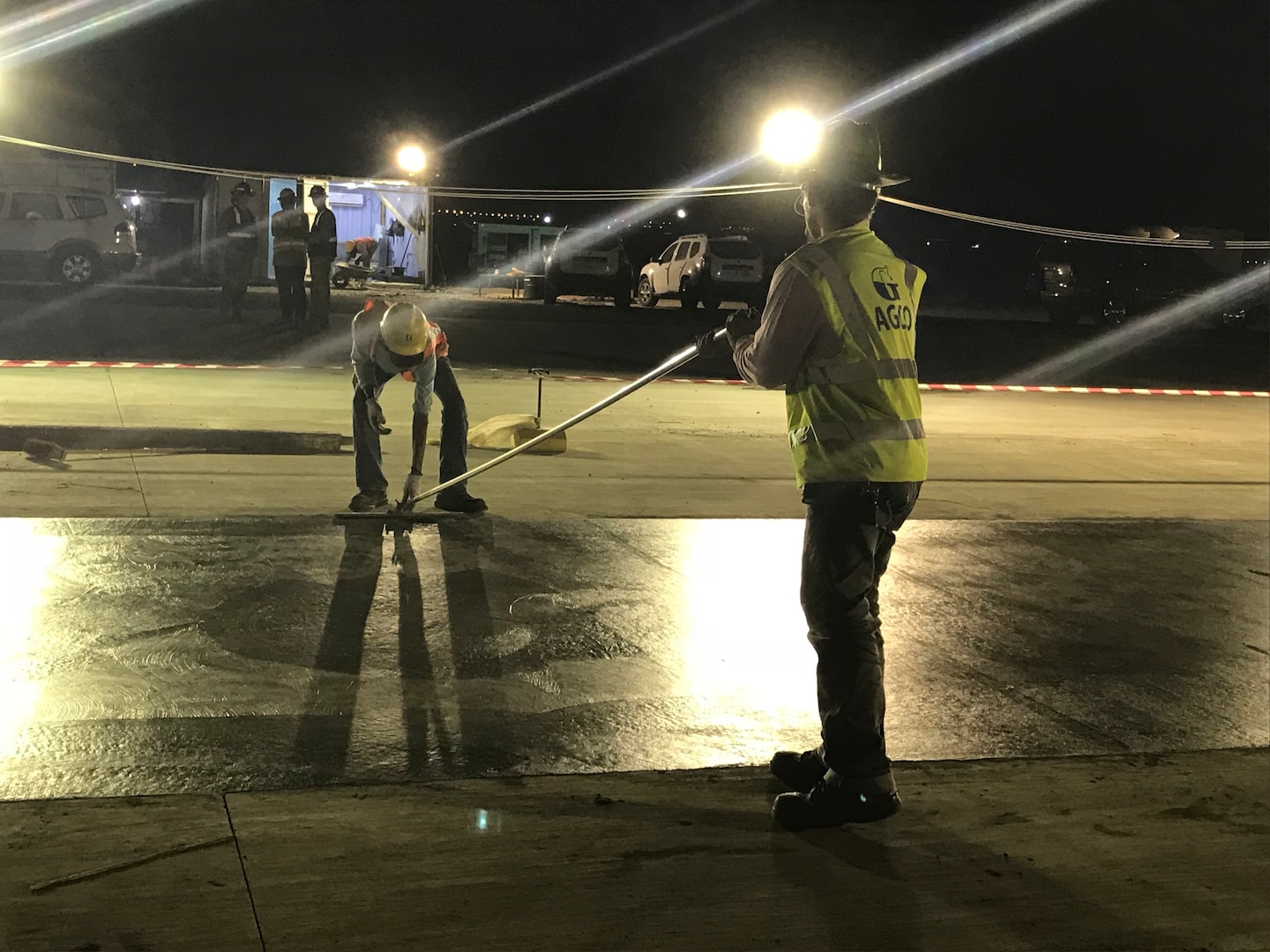 Contractors work at night to finish runway repairs at an undisclosed location in the Middle East.