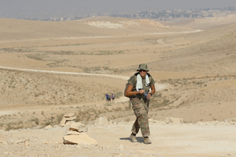 Sgt. Brenda Sant’Ana, with the 151st Regional Support Group, Massachusetts Army National Guard, crests a hill during the March For The Fallen–Jordan event Oct. 6, 2018. She was the top female finisher of the 28-mile, 35-pound rucksack march with a time of 8:03:15.