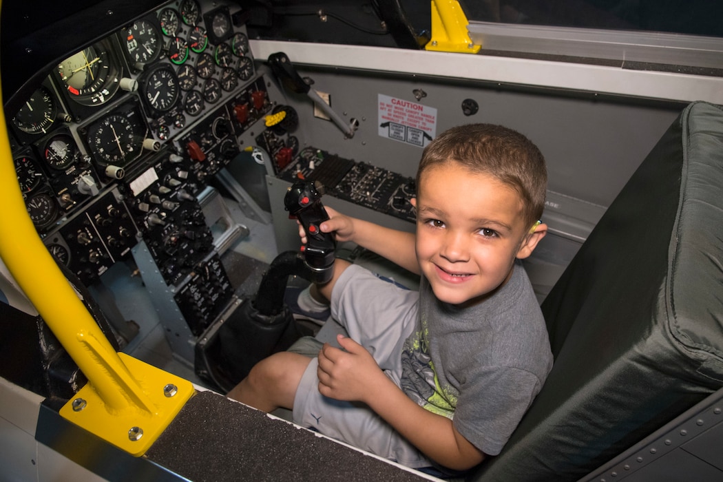 DAYTON, Ohio - A museum visitor enjoying the T-38 Sit-in Cockpit in the Cold War Gallery at the National Museum of the U.S. Air Force. (U.S. Air Force photo by Ken LaRock)