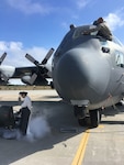 Airman 1st Class Melissa Mantilla  (in white suit) and Senior Airman Hopeton Gordon, members of the 106th Rescue Wing of the New York Air Natonal Guard, prep an HC-130 search and rescue aircraft for departure at Gabreski Air Natonal Guard Base in Westhampton Beach, N.Y., on Oct. 10, 2018, as the unit prepared to deploy a team to Gulfport, Mississippi, as part of the response to Hurricane Michael.