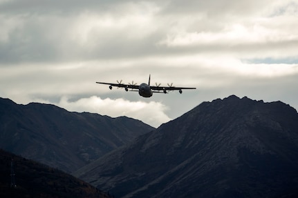 An Alaska Air National Guard C-130J Super Hercules conducts air drop qualification training at Joint Base Elmendorf-Richardson, Alaska, Oct. 3, 2018. When air drop training occurs, combat mobility technicians from the 773d Logistics Readiness Squadron are called upon to operate as malfunction officers at the drop zone. In addition to scouting the drop zone area during a training, technicians are also responsible to recover the loads and parachutes.