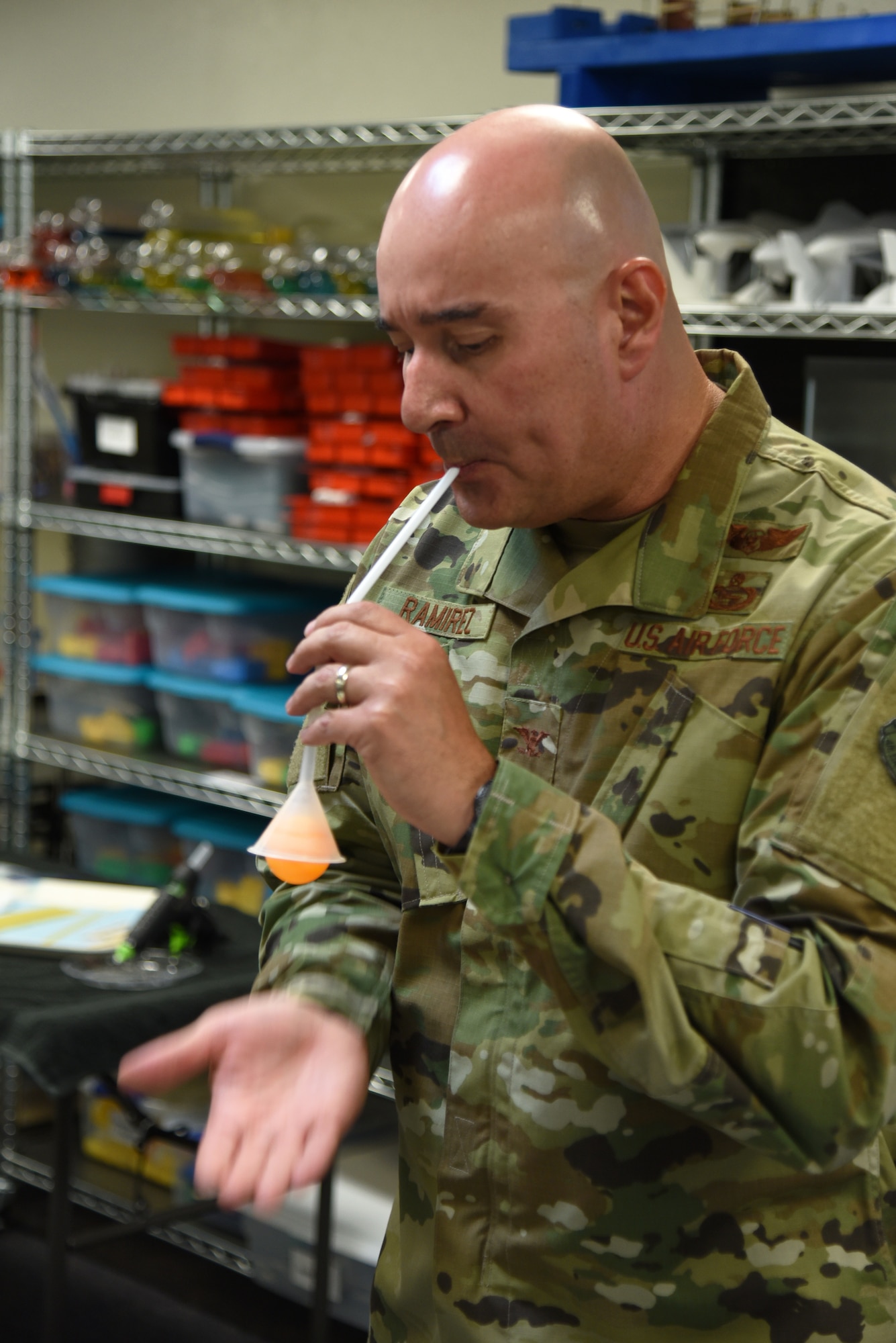 U.S. Air Force Col. Robert Ramirez, 17th Training Wing vice commander, keeps a ball suspended by blowing air at it during the one-year anniversary event of the STARBASE program at the STARBASE facility on Goodfellow Air Force Base, Texas, Oct. 10, 2018. Ramirez was using a technique taught to the STARBASE students called Bernoulli’s Principle. (U.S. Air Force photo by Staff Sgt. Joshua Edwards/Released)