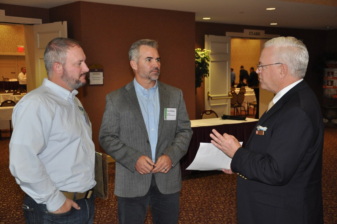 James Glynn, Walla Walla District's small business programs deputy, talks about U.S. Army Corps of Engineers small-business opportunities with Trent Milligan, AOR International Inc. president, and Jason Kanski, AOR International Inc. vice-president, during the 2018 Industry Day conference held Oct. 10, at the Marcus Whitman Hotel and Conference Center in Walla Walla, Washington. District personnel presented informational briefings, discussed upcoming contracting opportunities and processes, and a panel of District staff members involved with reviewing contract proposals answered questions posed by attendees
